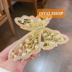 Pinza con forma de mariposa con perlas